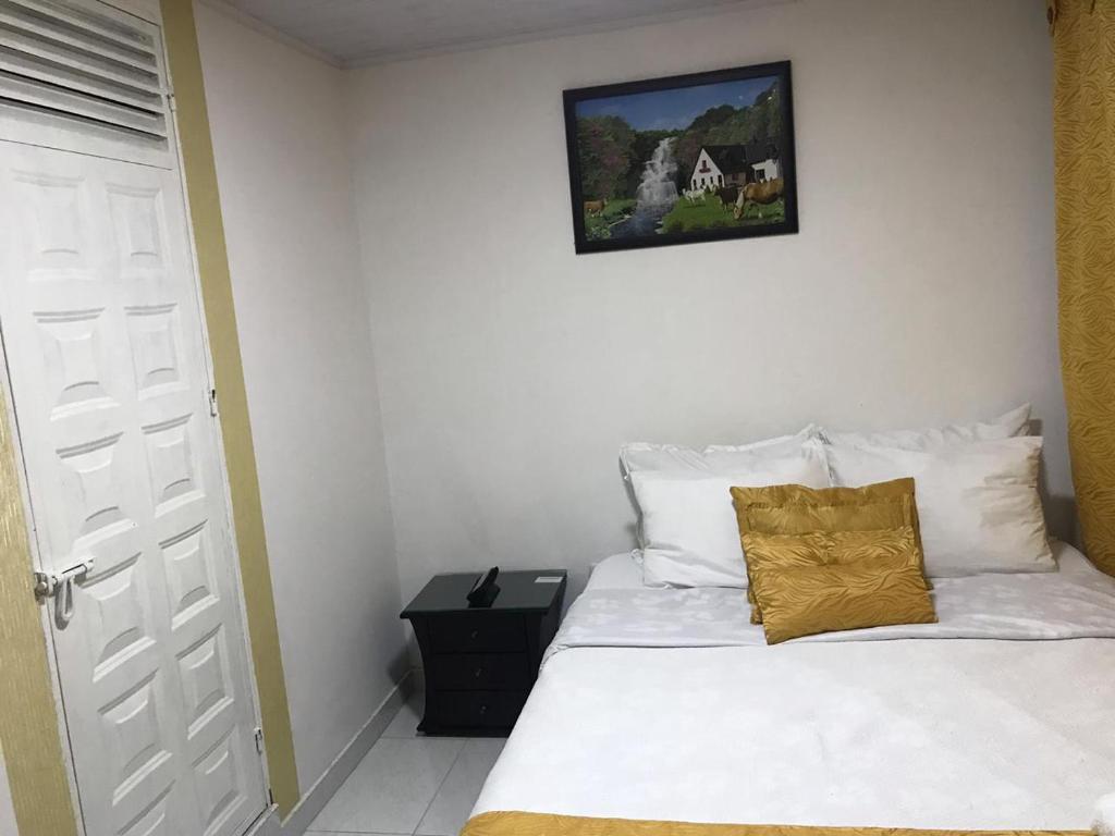 Postel nebo postele na pokoji v ubytování Hotel Casa Nini