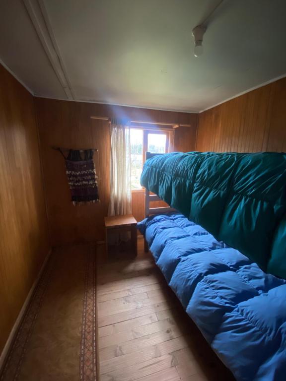 Ein Etagenbett oder Etagenbetten in einem Zimmer der Unterkunft Siempre Verde