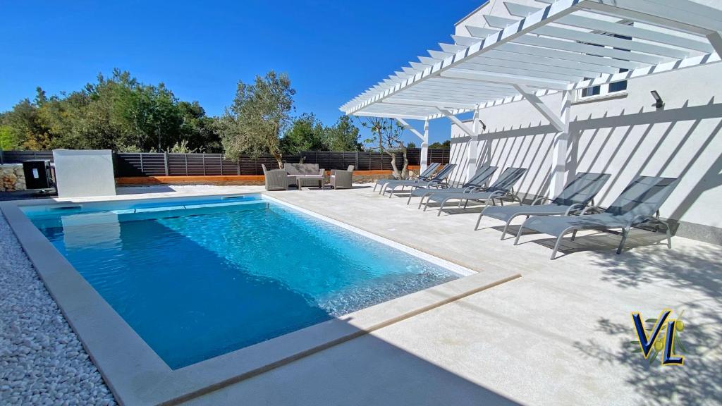 Fotografia z galérie ubytovania Pakostane - VRGADA -appartement 50 m2 avec piscine v Pakoštane