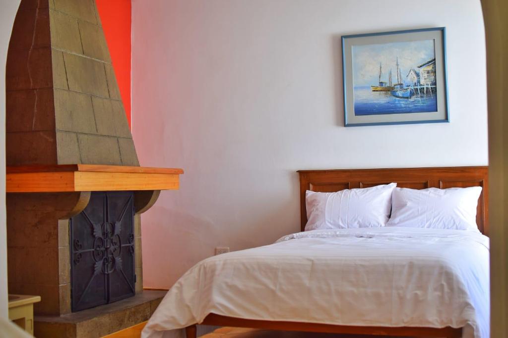 Postel nebo postele na pokoji v ubytování Hotel Ambassador