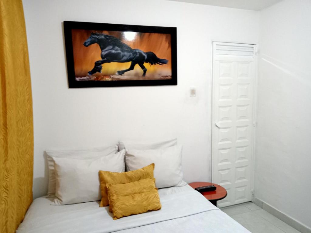 Postel nebo postele na pokoji v ubytování Hotel Casa Nini