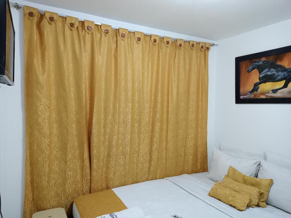Postel nebo postele na pokoji v ubytování Hotel Casa Nini