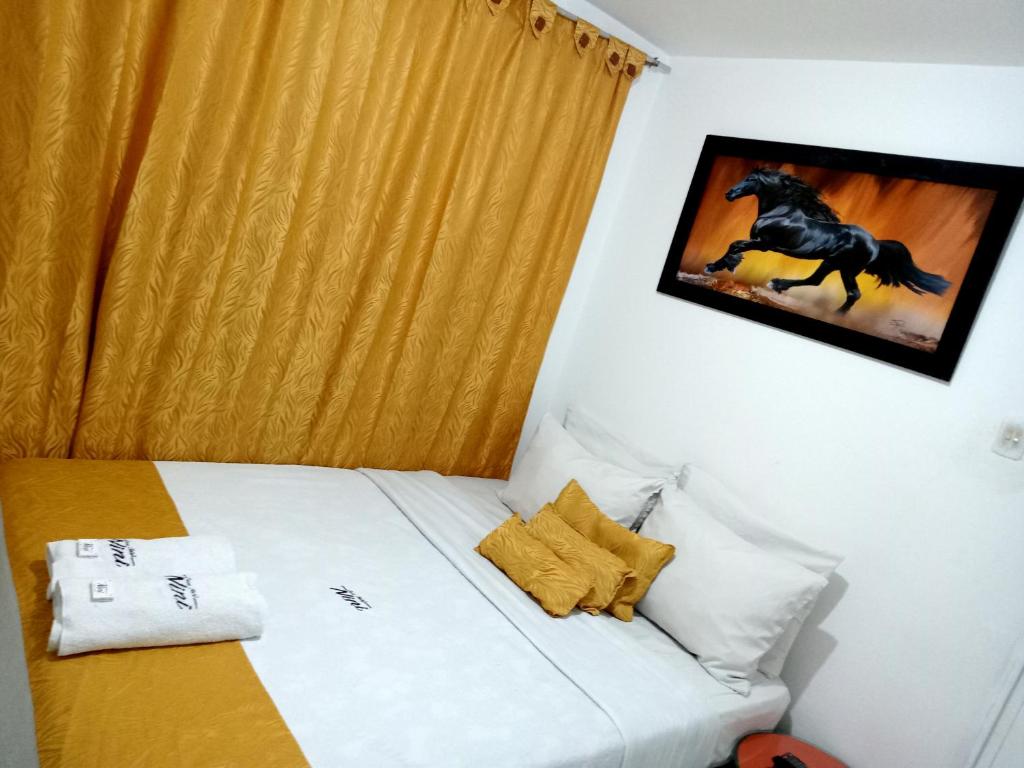 Postel nebo postele na pokoji v ubytování Hotel Casa Nini