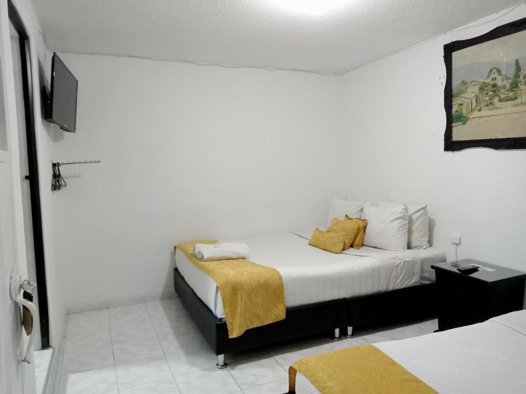 Postel nebo postele na pokoji v ubytování Hotel Casa Nini