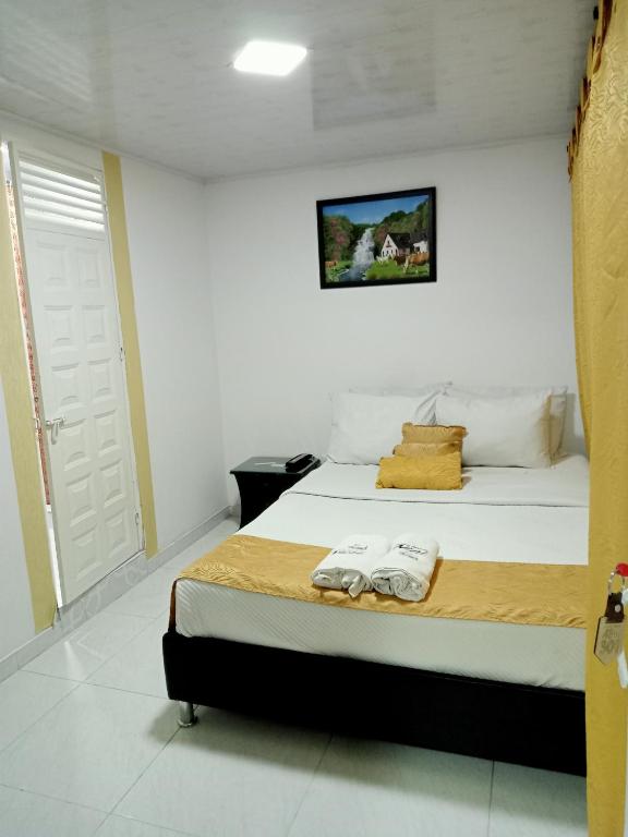 Postel nebo postele na pokoji v ubytování Hotel Casa Nini