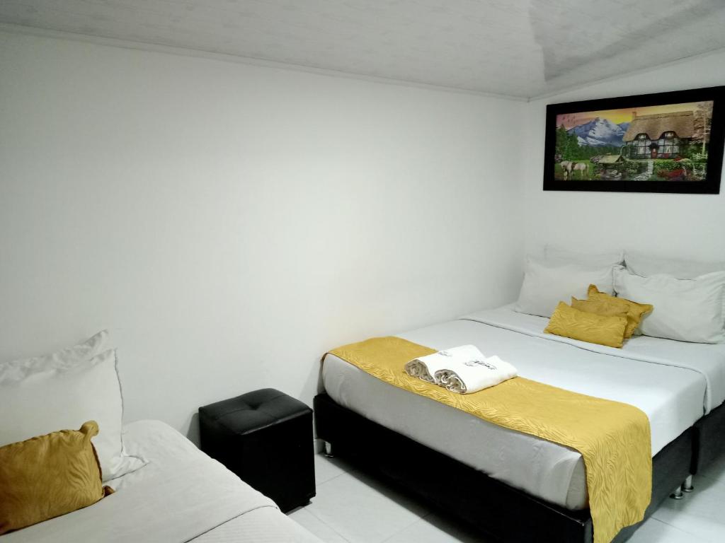 Postel nebo postele na pokoji v ubytování Hotel Casa Nini