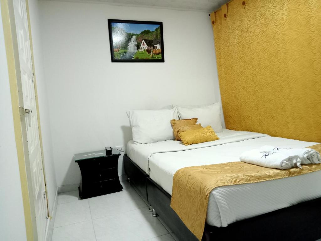 Postel nebo postele na pokoji v ubytování Hotel Casa Nini