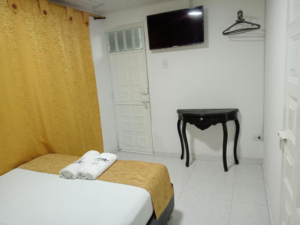 Postel nebo postele na pokoji v ubytování Hotel Casa Nini