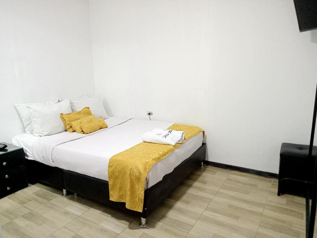 Postel nebo postele na pokoji v ubytování Hotel Casa Nini