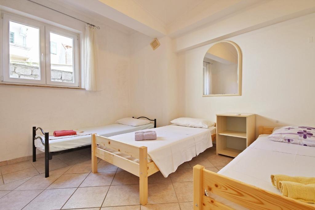 Postel nebo postele na pokoji v ubytování Guesthouse Lion