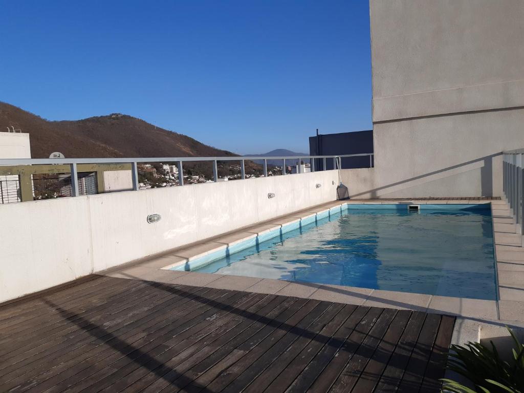 a swimming pool on the roof of a building at Departamentos Giovanni in Salta