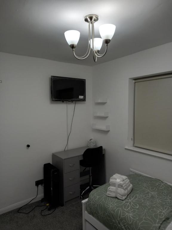 TV a/nebo společenská místnost v ubytování Cosy Home