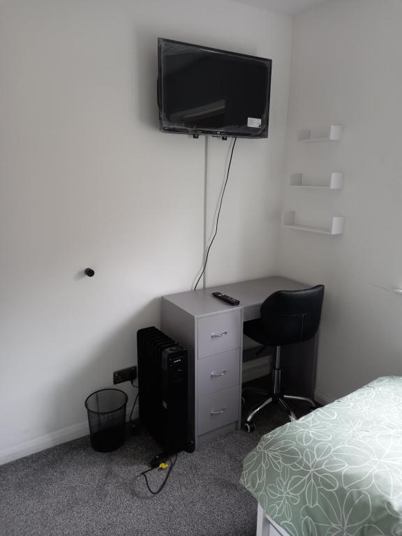TV a/nebo společenská místnost v ubytování Cosy Home