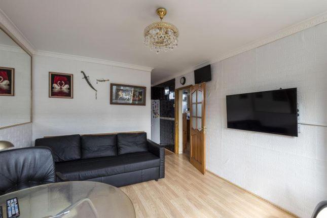 a living room with a couch and a flat screen tv at 1 Bedroom Flat Close to City with Free Parking Arrangement in London