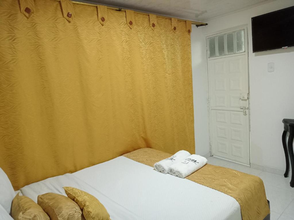 Postel nebo postele na pokoji v ubytování Hotel Casa Nini
