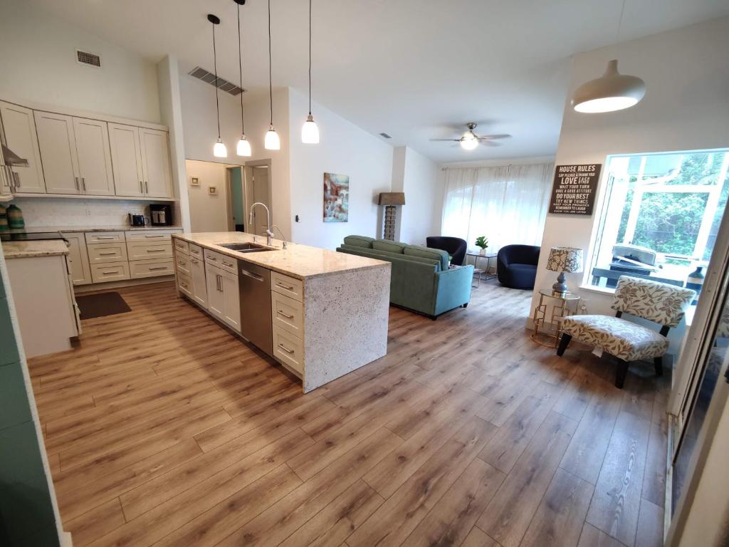 an open kitchen and living room of a house at Spacious OASIS Updated Home 3 bed 2 bath -7 min to Nokomis Beach in Nokomis
