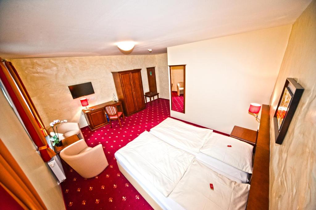 Postel nebo postele na pokoji v ubytování Hotel Medaillon