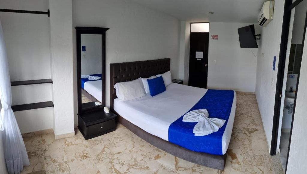 Postel nebo postele na pokoji v ubytování Blue Star Hotel