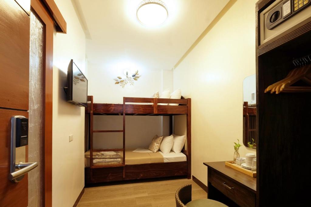 Postel nebo postele na pokoji v ubytování Jai-cob’s Suites