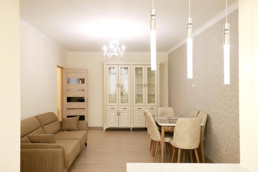 a living room with a couch and a table at Dilijan is for U in Dilijan