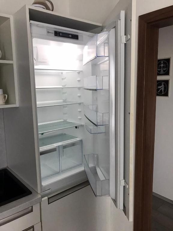 Kuchyň nebo kuchyňský kout v ubytování Příjemný apartmán Křoví v rodinném domku se sdíleným bazénem, terasou a zahradou