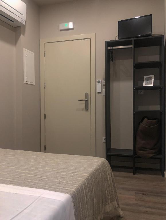 TV a/nebo společenská místnost v ubytování Rua Grande Hotel