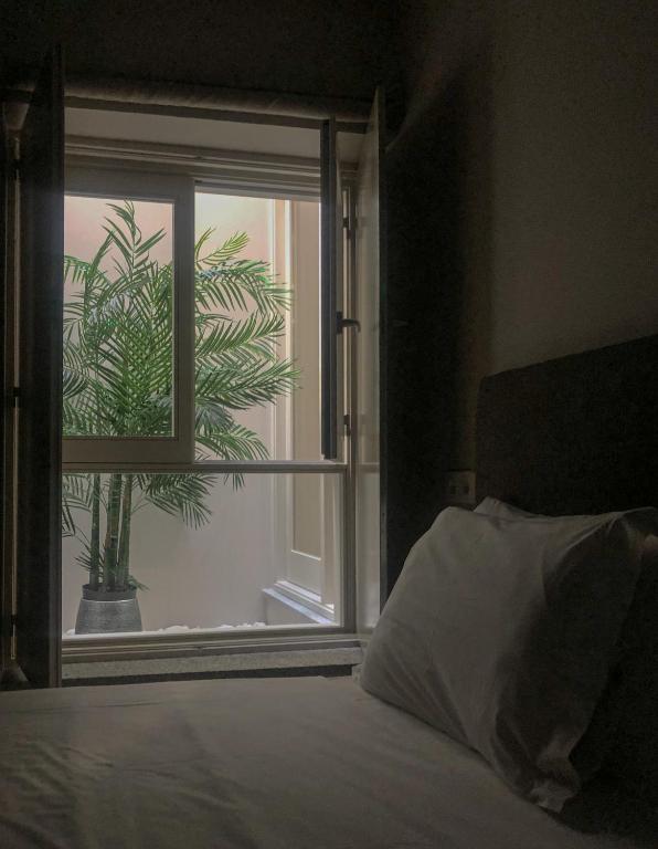 Postel nebo postele na pokoji v ubytování Rua Grande Hotel