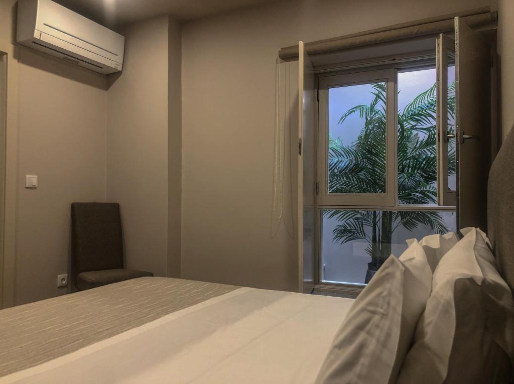 Postel nebo postele na pokoji v ubytování Rua Grande Hotel