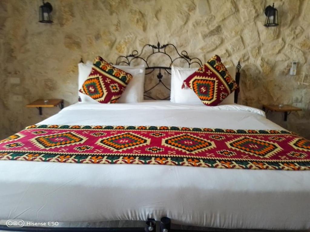 Postel nebo postele na pokoji v ubytování Infinity Lodge