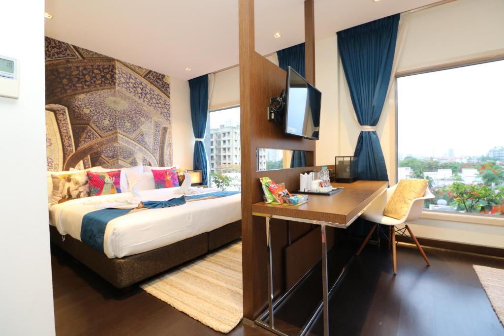 Postel nebo postele na pokoji v ubytování Hotel Gallery 67