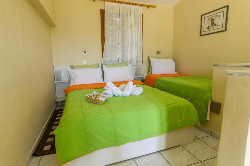 Postel nebo postele na pokoji v ubytování Stathopoulos Apartments