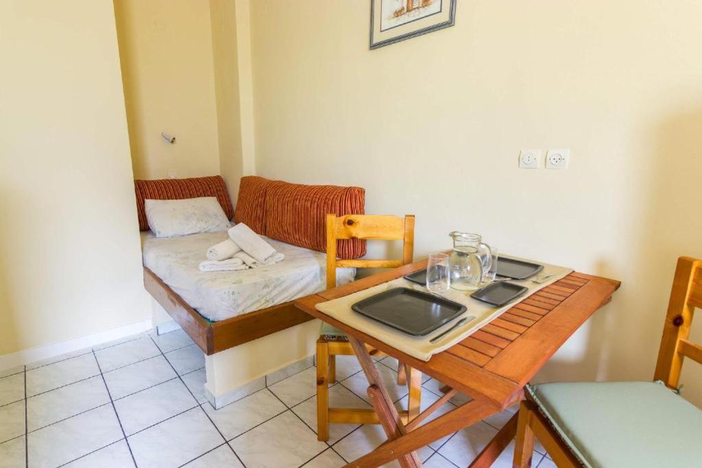 Postel nebo postele na pokoji v ubytování Stathopoulos Apartments