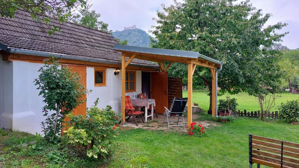 a small house with a gazebo in a yard at Pavlov24 - Zahradní domečky in Pavlov