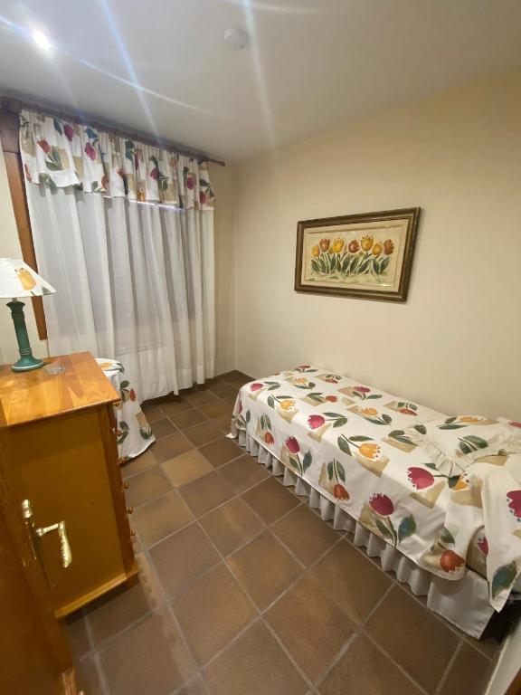 Postel nebo postele na pokoji v ubytování Cal Cuaresma