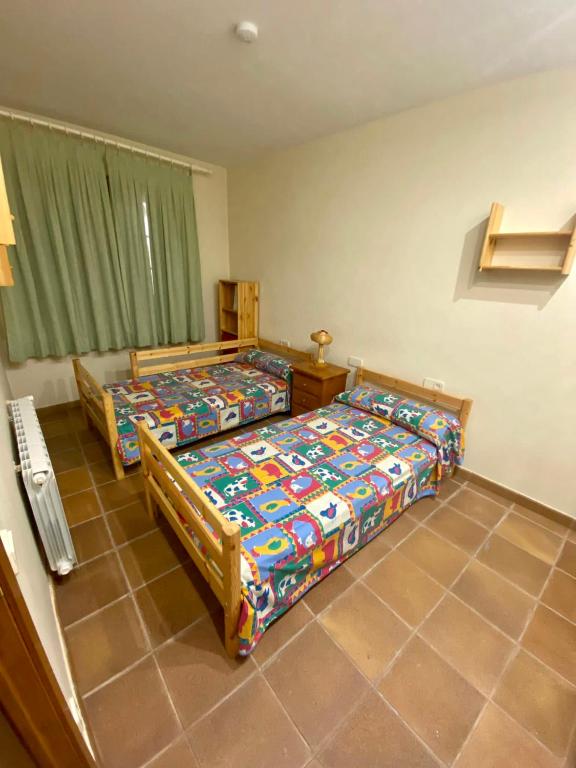 Postel nebo postele na pokoji v ubytování Cal Cuaresma