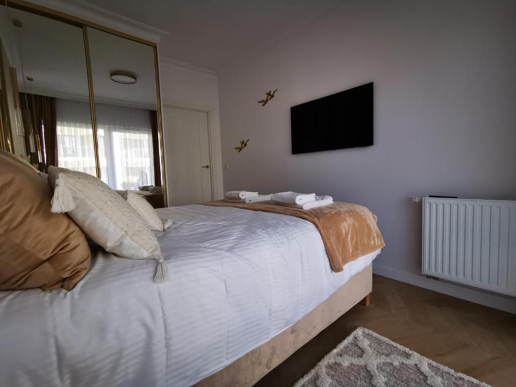 Posteľ alebo postele v izbe v ubytovaní Gold Apartment B29 Let's Sea Baltic Park Gąski