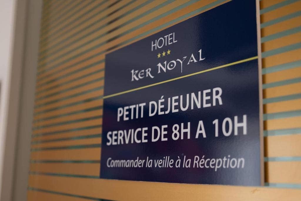 a sign that reads hotel keep novalfifth december service de at Hôtel Ker-Noyal Quiberon Plage in Quiberon