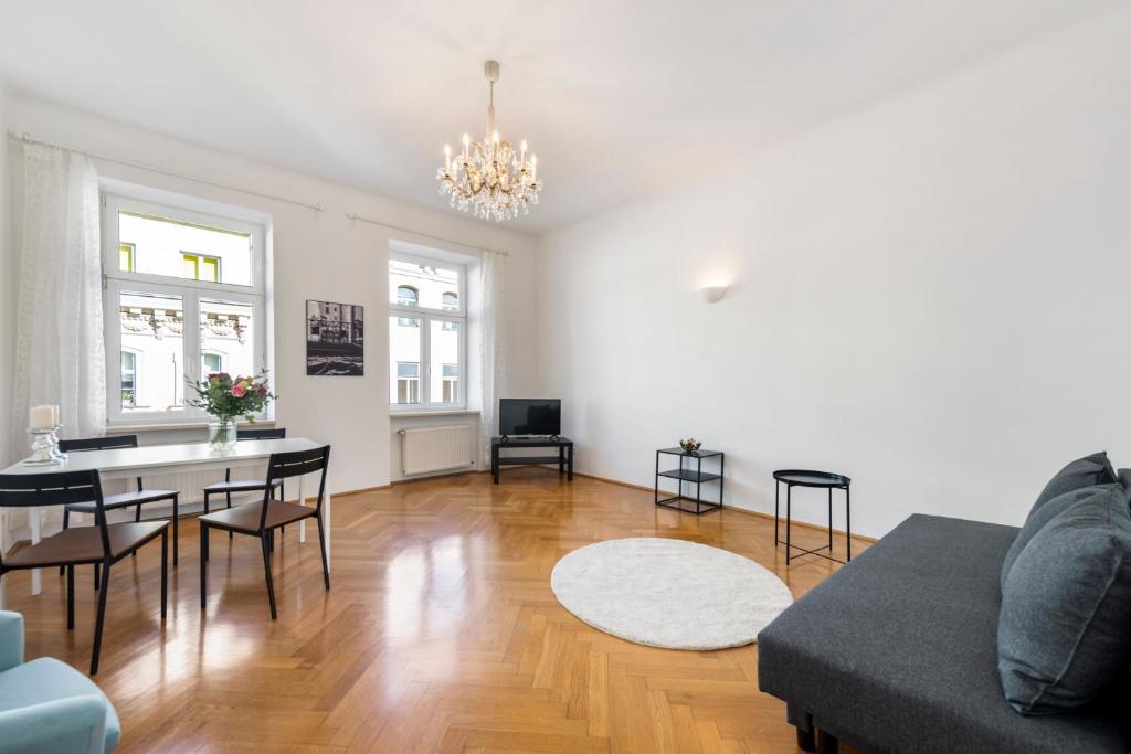 a living room with a couch and a table at A&S Center Apartment Vienna in Vienna