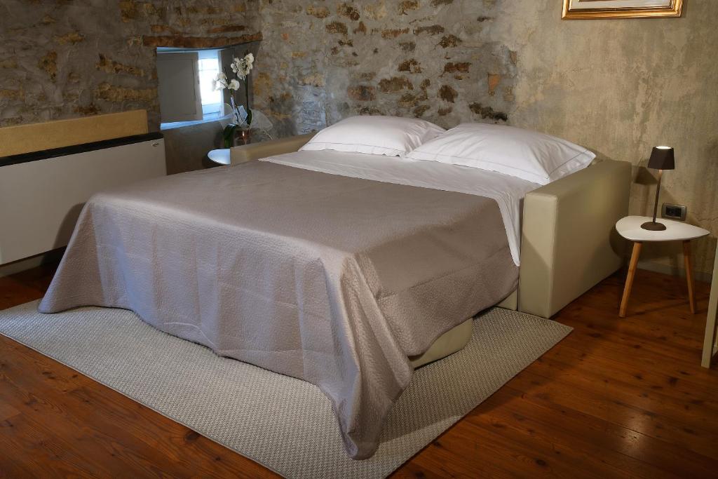 Letto o letti in una camera di Cà 'd Calin Casa nel Borgo