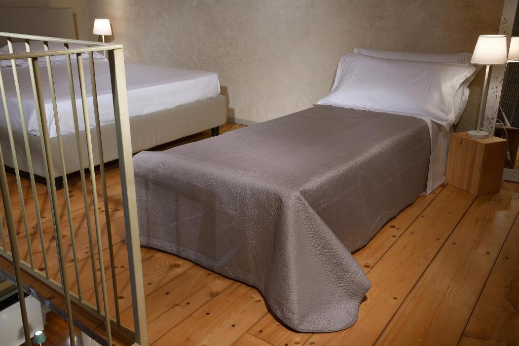 Letto o letti in una camera di Cà 'd Calin Casa nel Borgo
