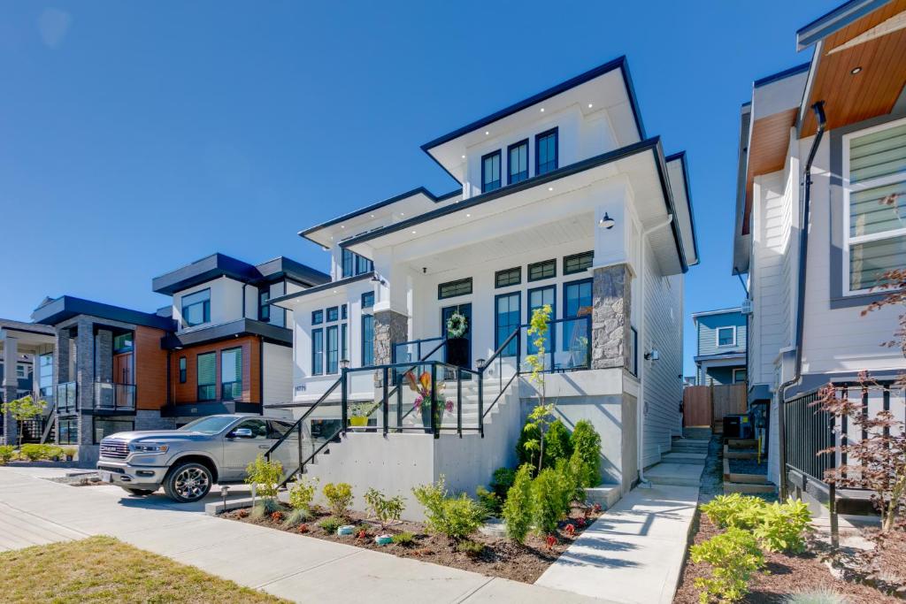 a house with a car parked in front of it at Guest suite in South Surrey in Surrey