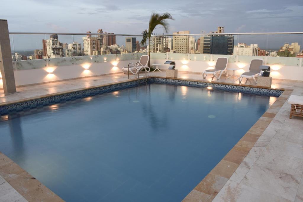 a swimming pool on the roof of a building at Radisson Diamond Barranquilla in Barranquilla