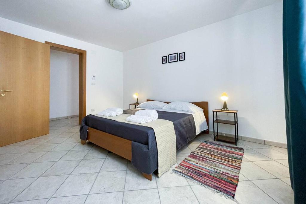 Postel nebo postele na pokoji v ubytování Relax e spazio a due passi dal mare