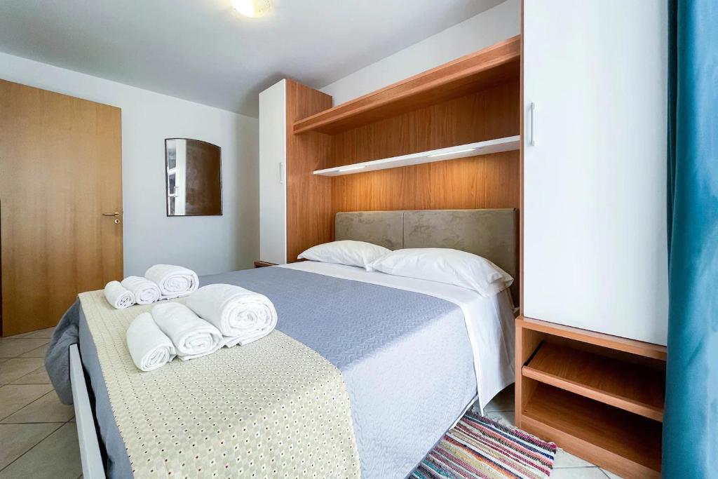 Postel nebo postele na pokoji v ubytování Relax e spazio a due passi dal mare