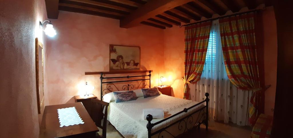 Łóżko lub łóżka w pokoju w obiekcie Agriturismo Corte degli Angeli