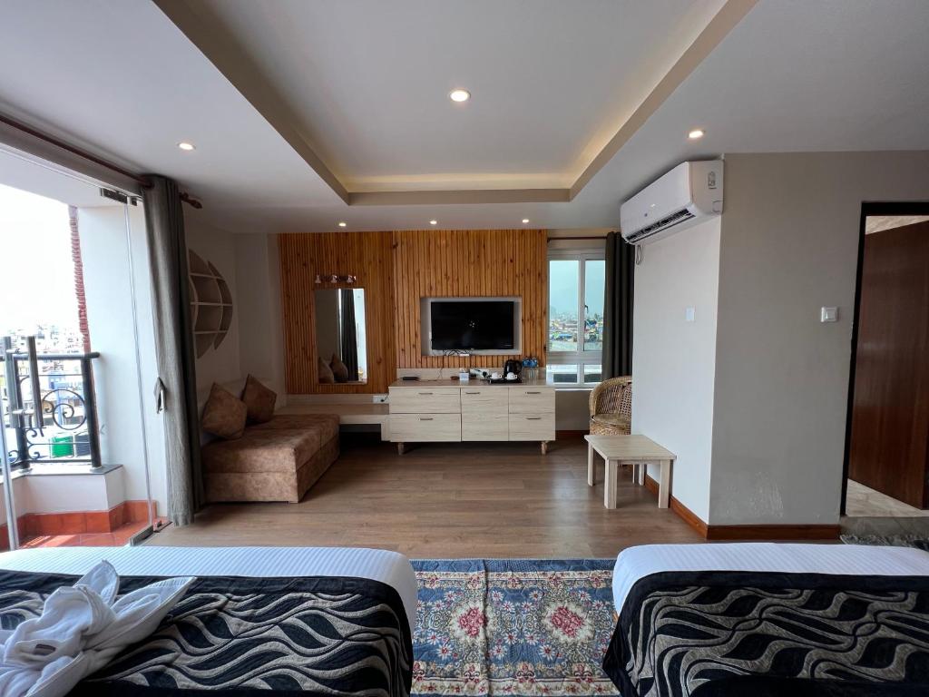 TV a/nebo společenská místnost v ubytování Hotel Kesu Home