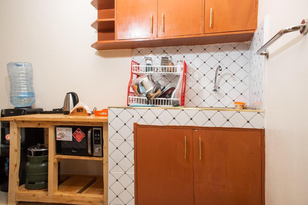 Kuchyň nebo kuchyňský kout v ubytování Nelly fully furnished studios