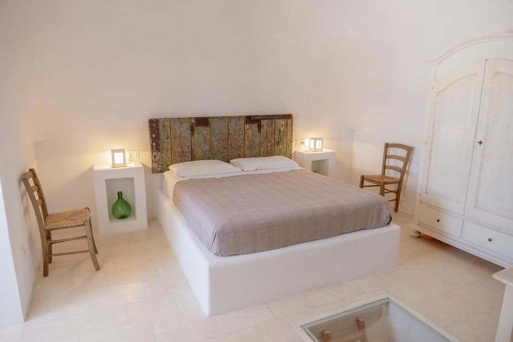 Posteľ alebo postele v izbe v ubytovaní Trulli sul Mare Forcatella