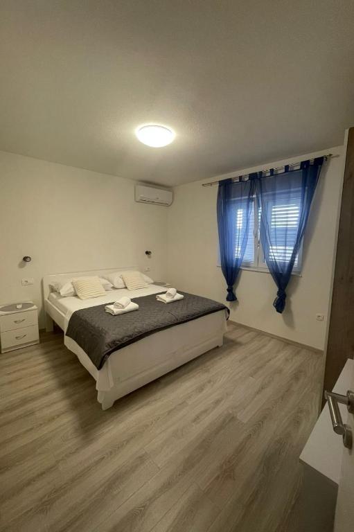 Postel nebo postele na pokoji v ubytování Villa Ante Škina