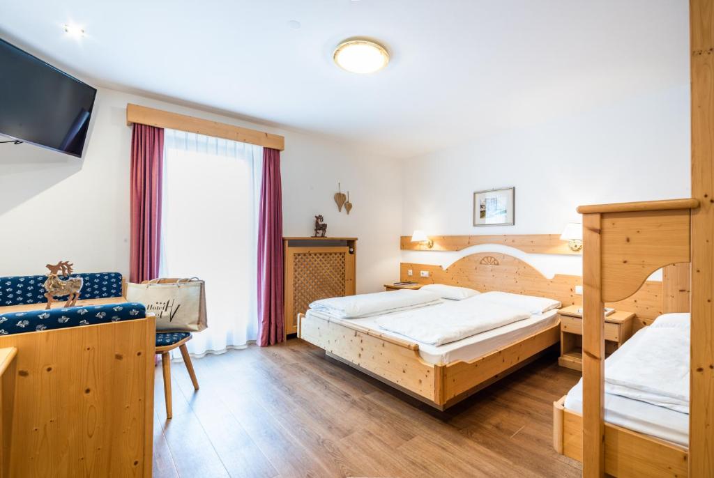 Posteľ alebo postele v izbe v ubytovaní Hotel Vernel